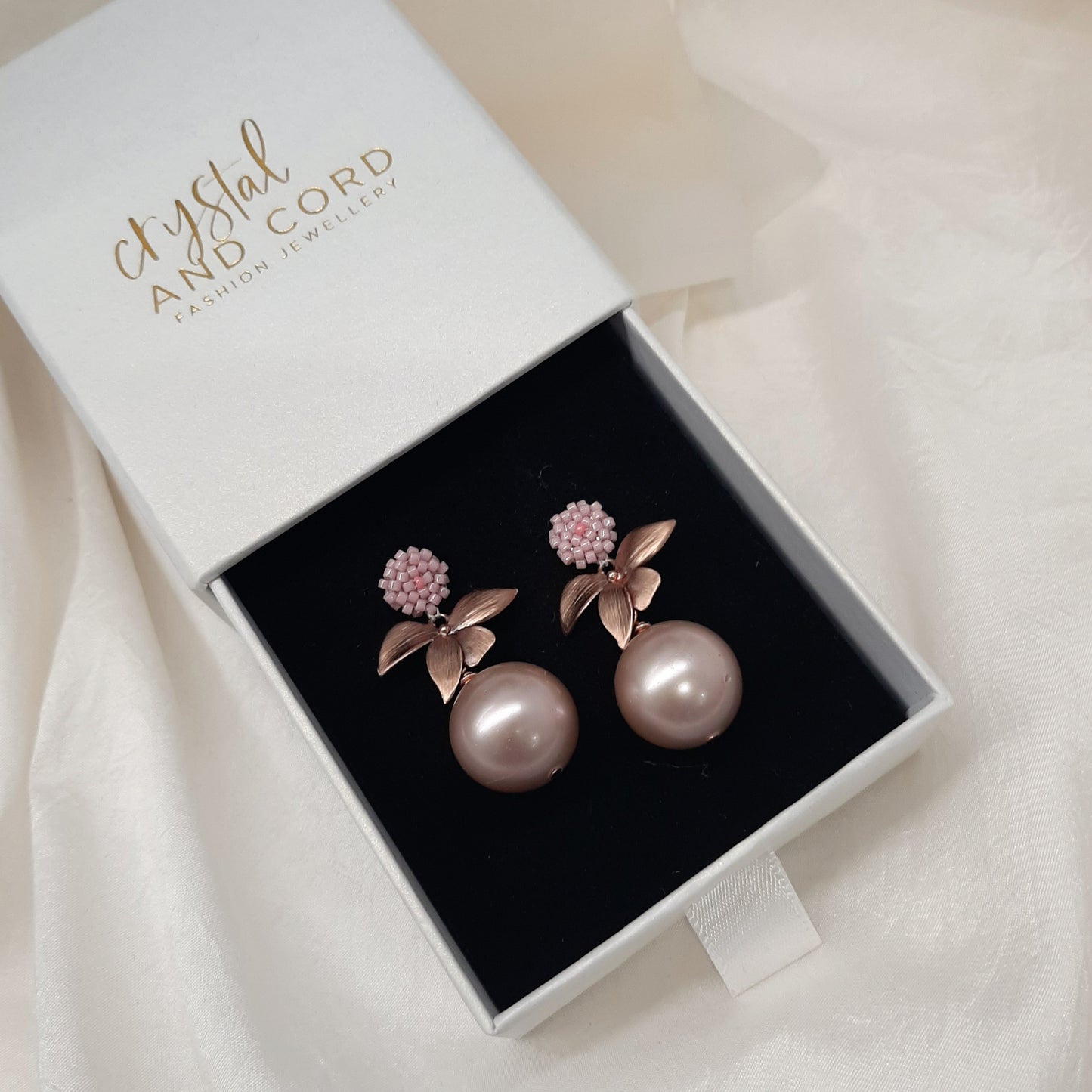 Arella - round shell bead pearl single orchid shaped flower drop earrings