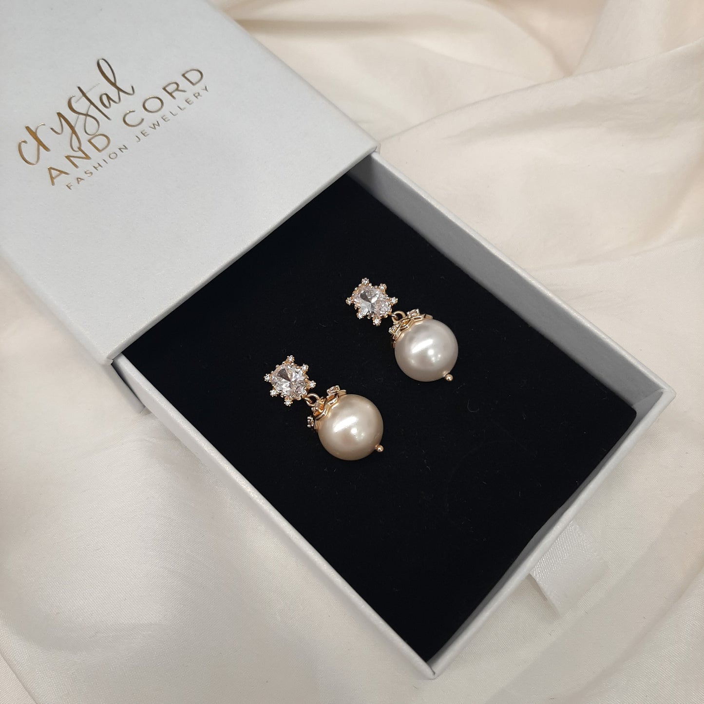 Calista - cubic zirconia stud and embellished pearl drop earrings