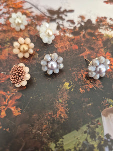 Elara Dusk - flower shaped stud earrings with glass beads and a pearl center