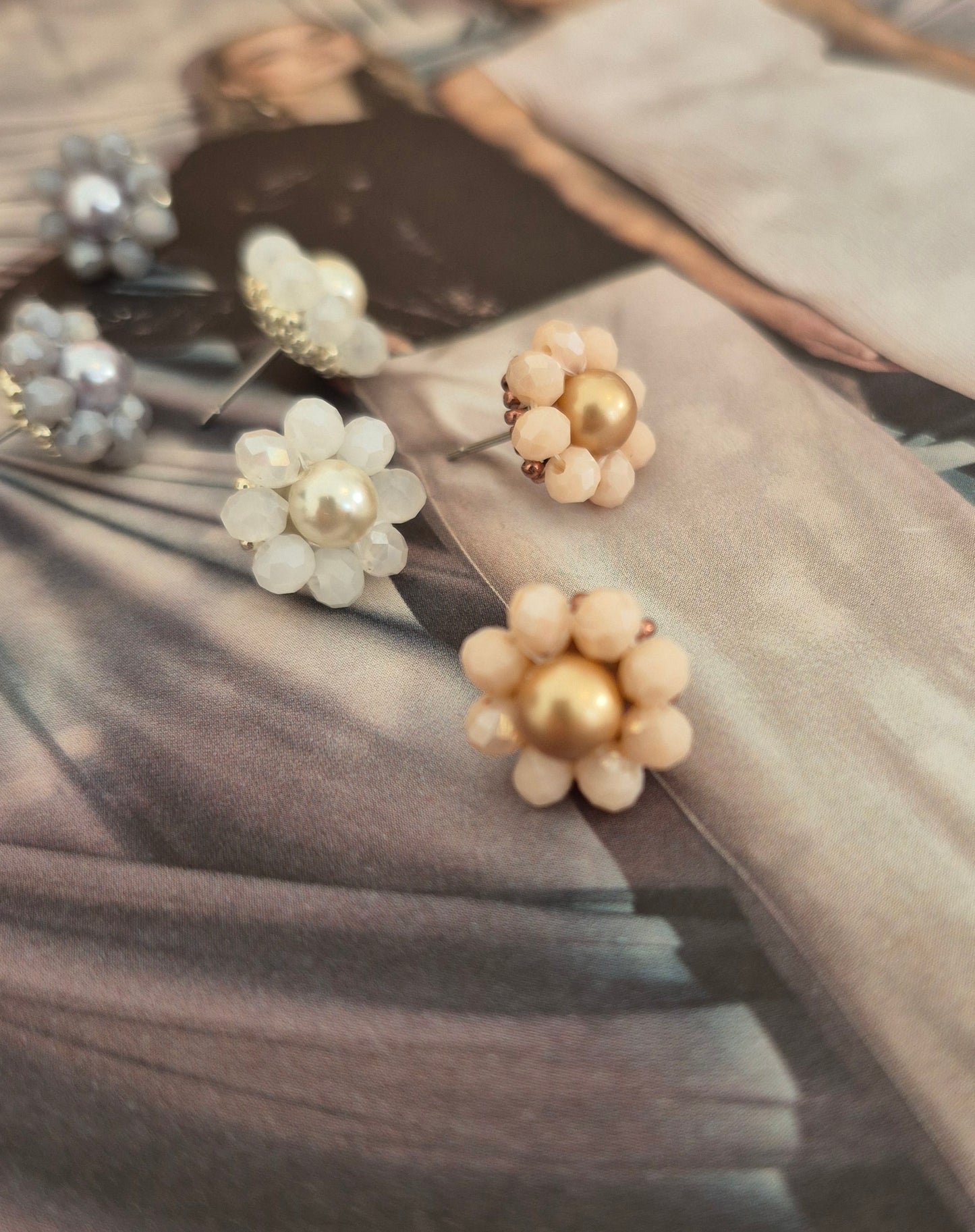 Elara Dusk - flower shaped stud earrings with glass beads and a pearl center