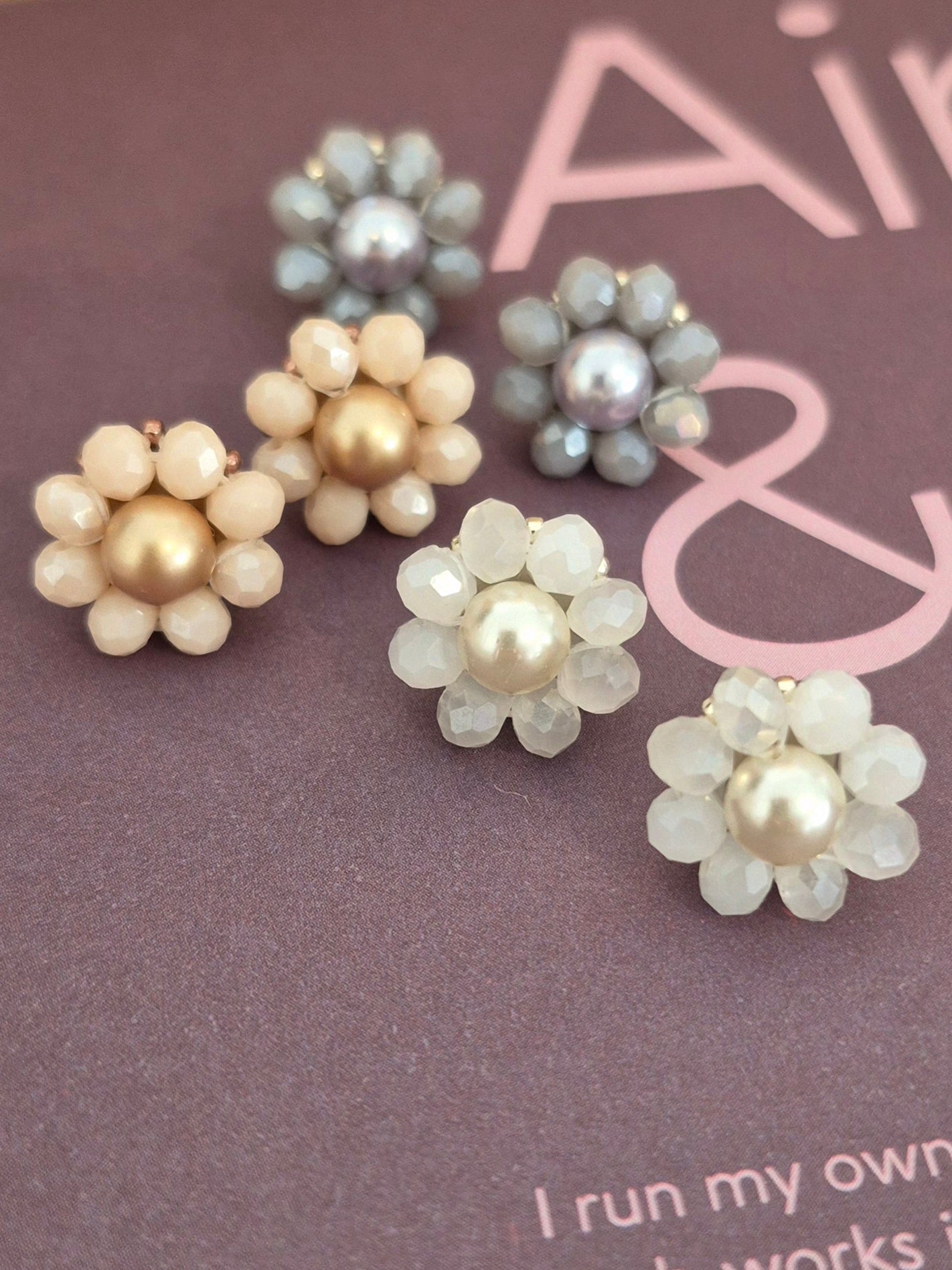 Elara Dusk - flower shaped stud earrings with glass beads and a pearl center