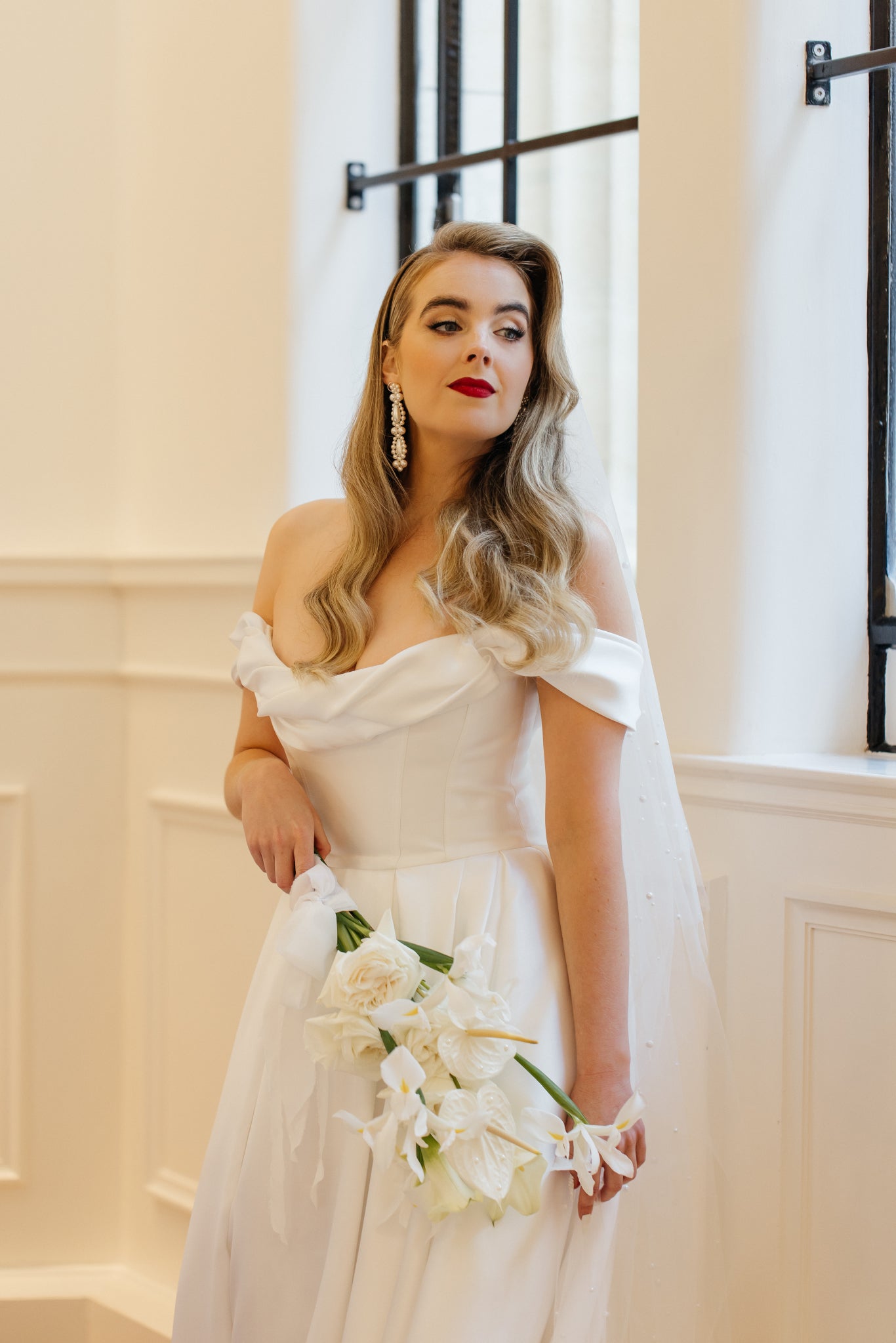 Elizabeth - white round and teardrop shaped crystal pearls cascading stud earrings