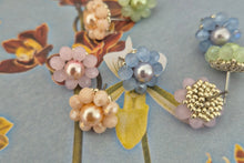 Load image into Gallery viewer, Close up of CrystalandCord pastel flower stud earrings