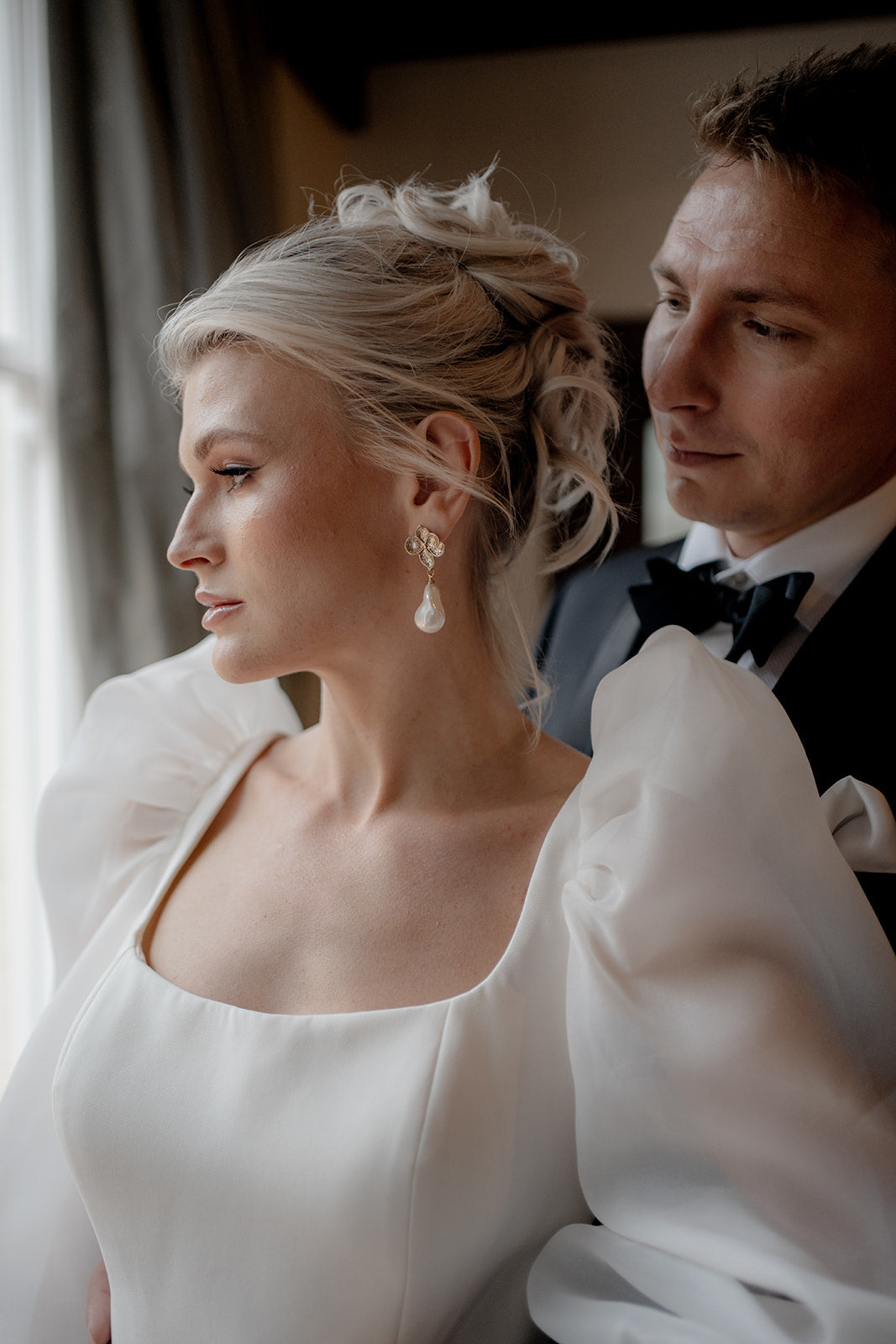 Monica - faux pearl drop and gold tone five petal flower stud earrings