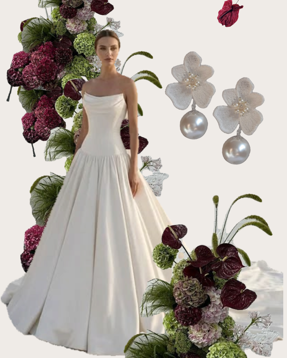 A woman wearing a fitted strapless white wedding gown stands beside large floral arrangements with burgundy, green, and pale pink flowers, plus two white lace flower-shaped earrings with round pearl drops on a light background, by CrystalandCord.