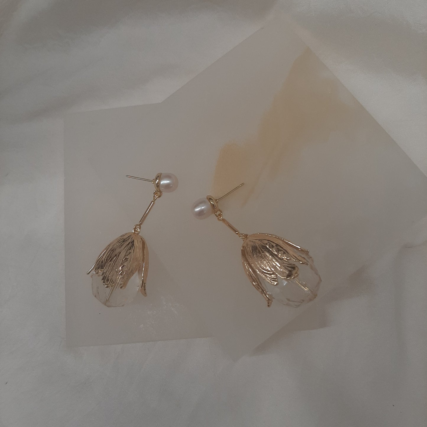 Susannah - glass faceted crystal clear teardrop and gold tone stud earrings