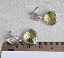 Load image into Gallery viewer, Peridot faceted glass bead and silver-tone leaf drop stud earrings