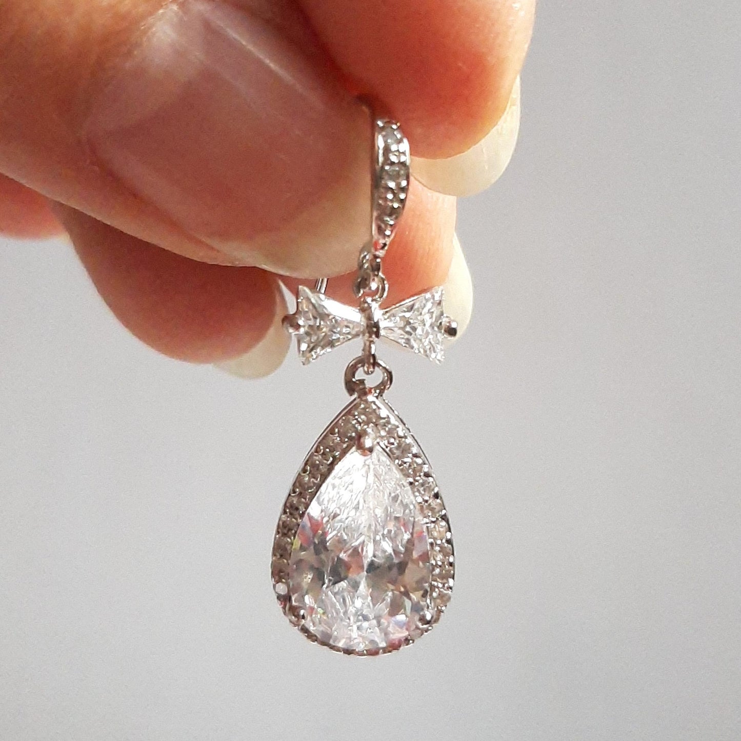 Yvette - Cubic Zirconia crystal clear heart, bow and pear shaped drop silver-tone stud earrings