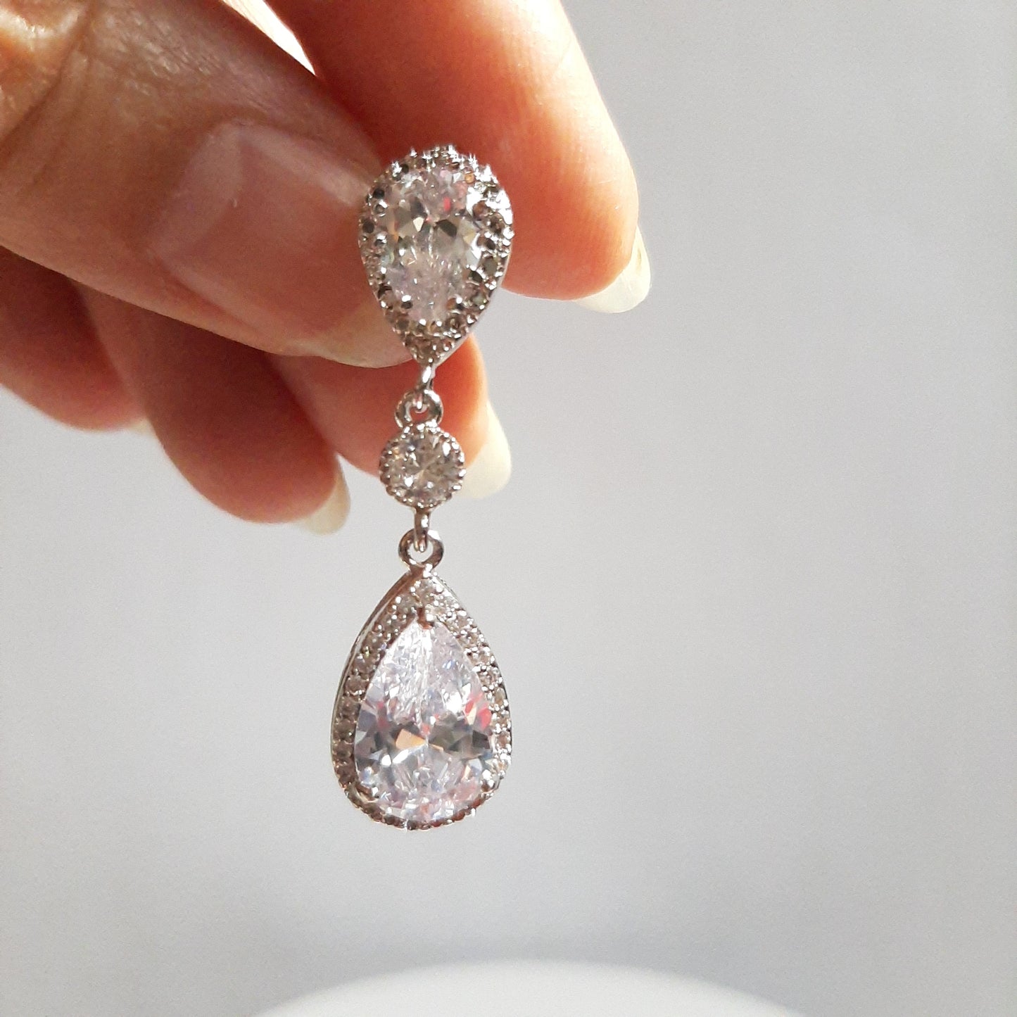 Angelica - Cubic Zirconia crystal clear silver-tone pear shaped drop stud earrings