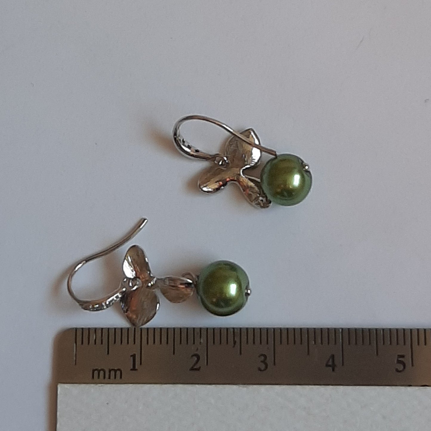 Rachel - faux pearl and small shiny silver-tone orchid shaped flower drop earrings