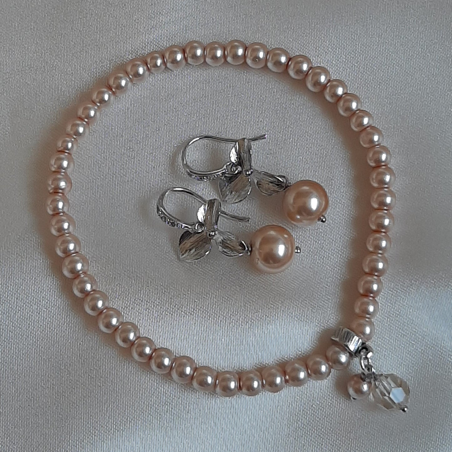 Rachel - faux pearl and small shiny silver-tone orchid shaped flower drop earrings
