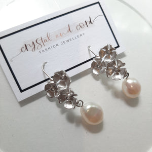 Maia - silver-tone triple flower rhinestone centered pearl drop earrings