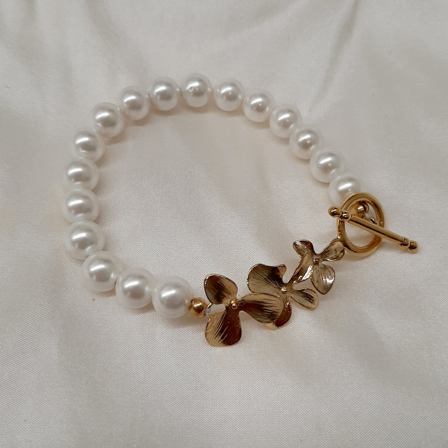 Clara - natural freshwater pearls or crystal based pearls and orchid shaped links bracelet with toggle clasp