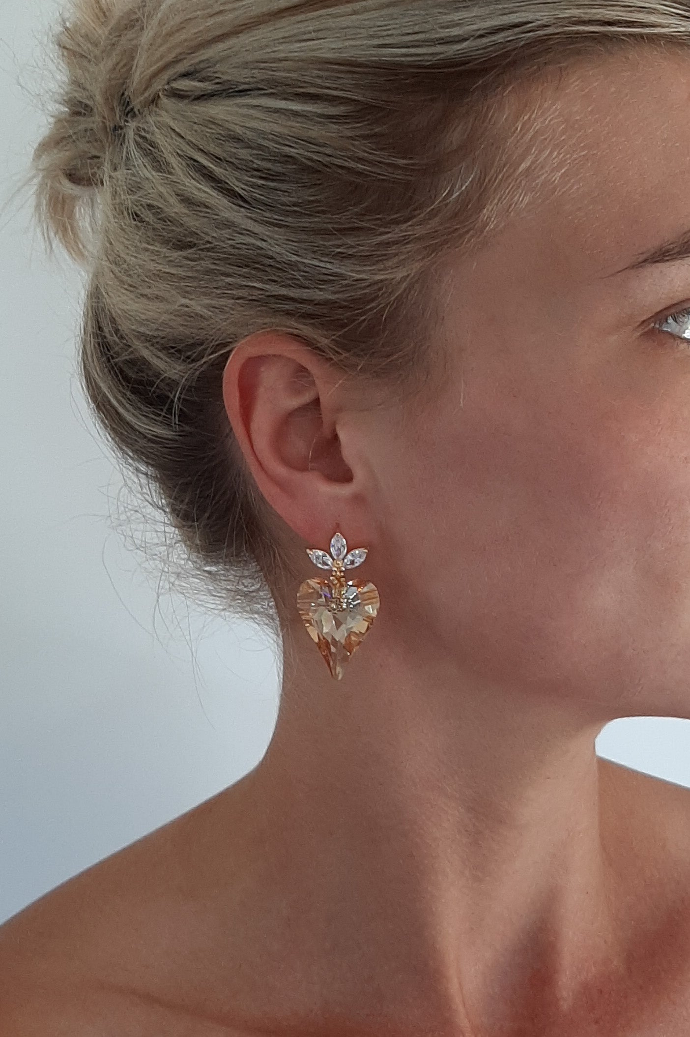 Victoria - golden shadow crystal heart suspended from cubic zirconia gold-tone earstuds