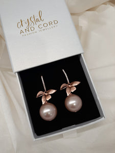 Arella - round shell bead pearl single orchid shaped flower drop earrings