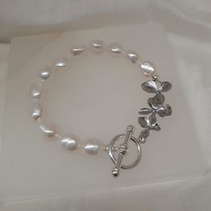 Clara - natural freshwater pearls or crystal based pearls and orchid shaped links bracelet with toggle clasp
