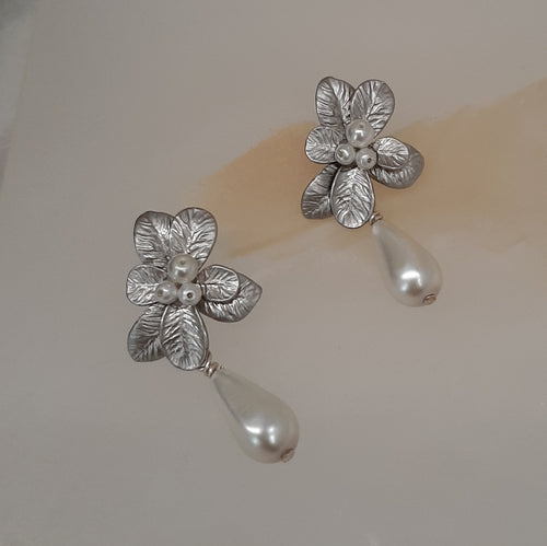 Marcy - faux pearl drop and silver-tone seven petal flower stud earrings