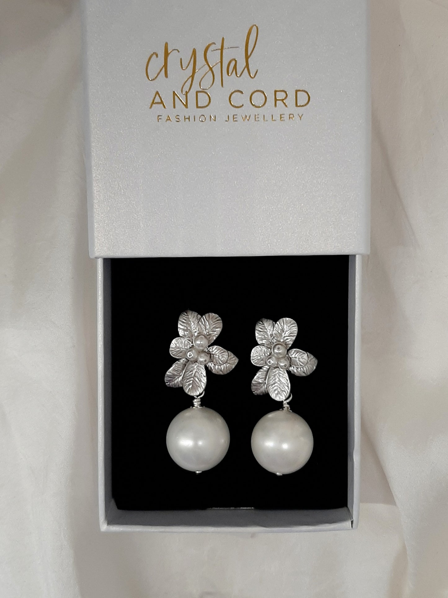 Marcy - faux pearl drop and silver-tone seven petal flower stud earrings