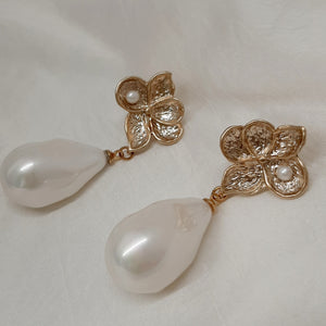 Monica - faux pearl drop and gold tone five petal flower stud earrings