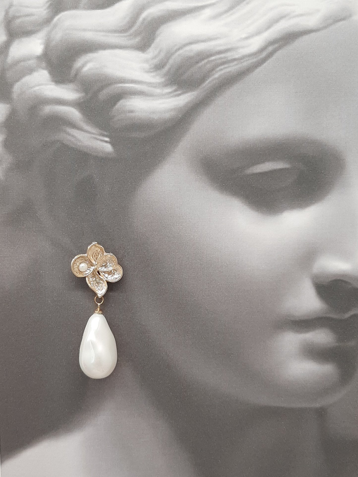 Monica - faux pearl drop and gold tone five petal flower stud earrings