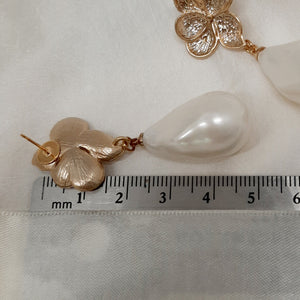 Monica - faux pearl drop and gold tone five petal flower stud earrings