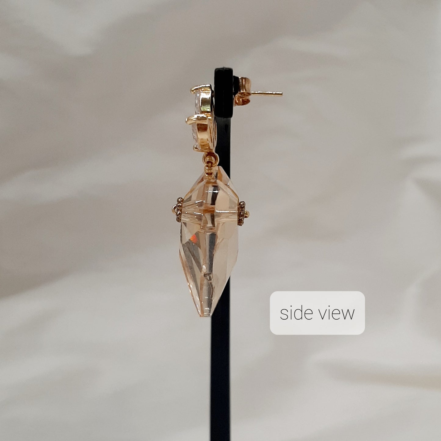 Victoria - golden shadow crystal heart suspended from cubic zirconia gold-tone earstuds