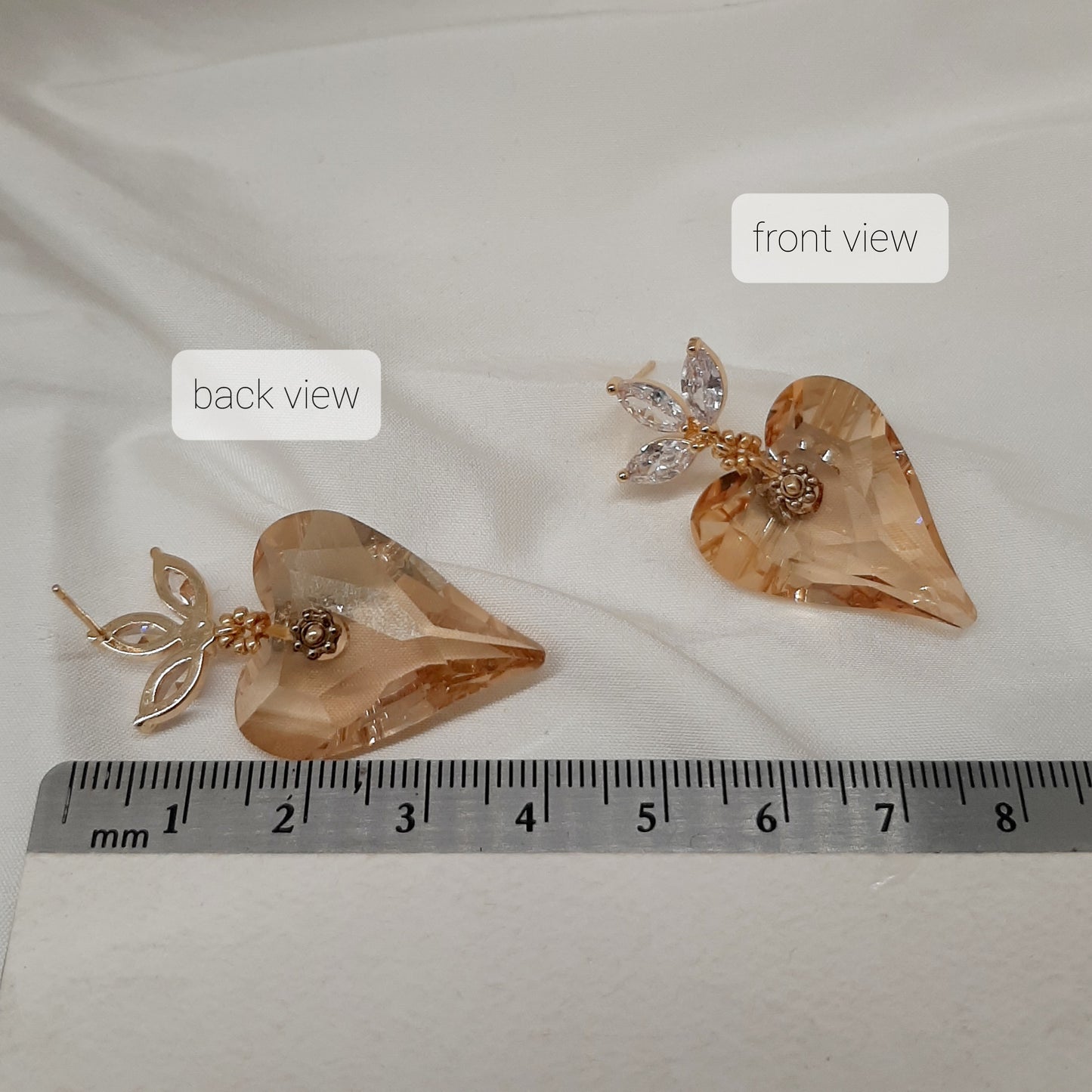 Victoria - golden shadow crystal heart suspended from cubic zirconia gold-tone earstuds