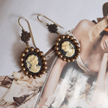 Load image into Gallery viewer, Cameo antiqued brass pearls and cross drop earrings